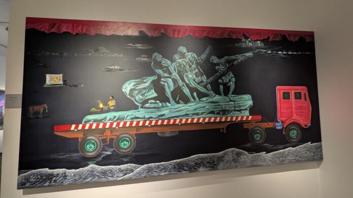 Actor Sawan Kumar's work in the show in Kochi uses trucks as a symbol to search for political and personal conflicts. 

